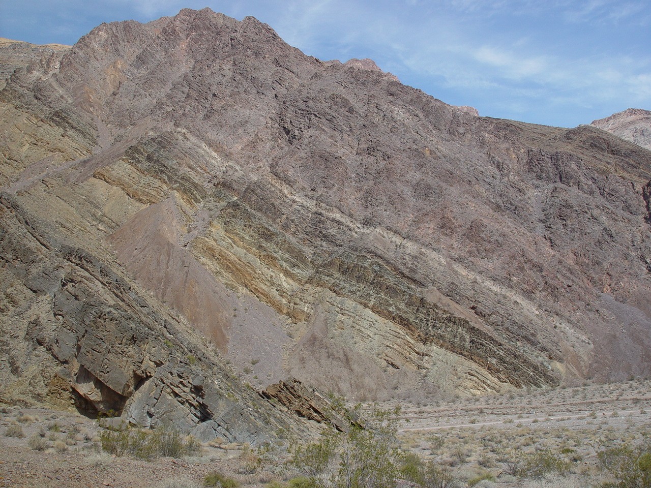 Overturned Zabriskie Quartzite (pink) and Carrara Formation (greenish grey) at Titus Canyon, Grapevine Mountains (2008)